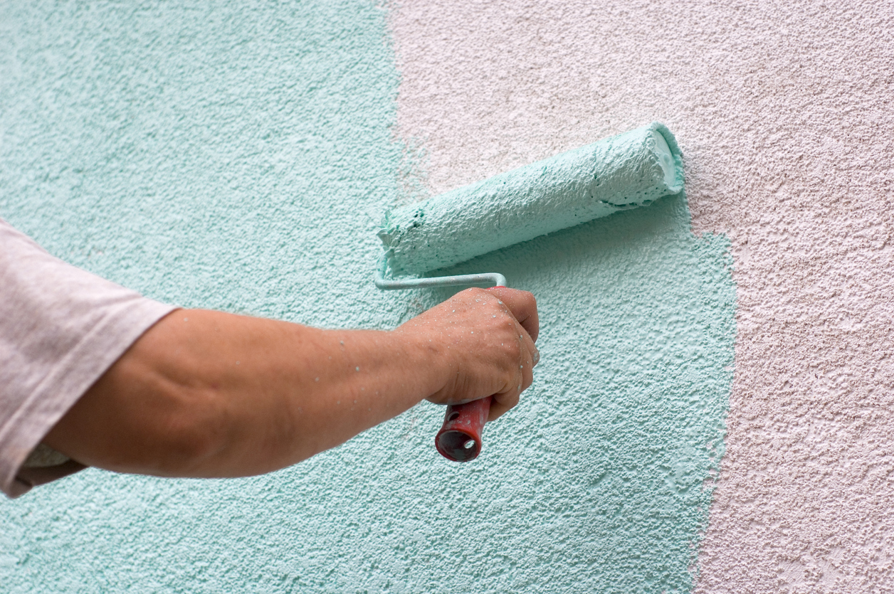 Painting an exterior wall with a fresh coat of paint in Livermore