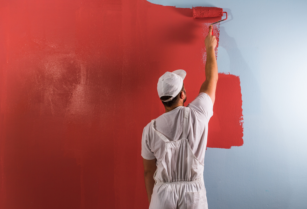 Professional painting wall with roller in the Tracy, CA