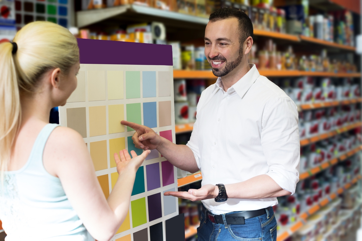 Man and woman picking paint color